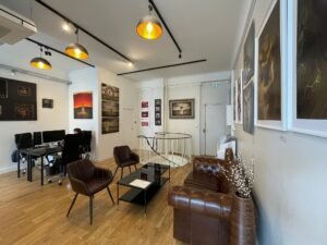 Spacious exhibition area with parquet flooring in art gallery