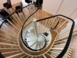 Spiral staircase leading to the gallery's lower level